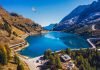 Viaggi in moto in Europa: le migliori destinazioni passo lago fedaia dolomiti in moto itinerario percorso giri vacanze